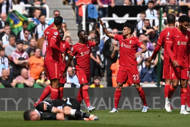 Naby Keita  celebrates with teammate Luis Diaz of Liverpool after scoring their team's first goal during the Premier League match between Newcastle United and Liverpool at St. James Park on April 30, 2022 in Newcastle upon Tyne, England. (Photo by Stu Forster/Getty Images)