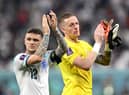 Kieran Trippier and Jordan Pickford applaud fans after England's 6-2 win over Iran.