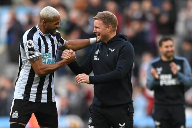 Newcastle United head coach Eddie Howe shares a joke with Joelinton after the Brentford win.