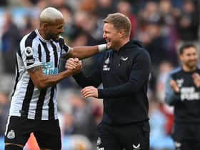 Newcastle United head coach Eddie Howe shares a joke with Joelinton after the Brentford win.