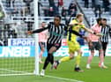 Joe Willock of Newcastle United celebrates after scoring his team's first goal during the Premier League match between Newcastle United and Sheffield United at St. James Park on May 19, 2021 in Newcastle upon Tyne, England.