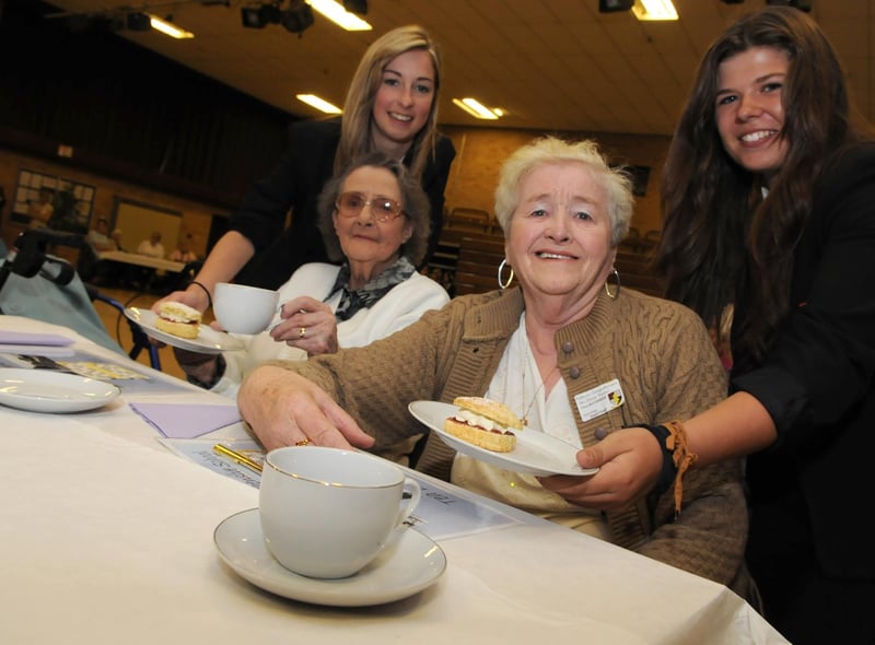 Hebburn Comprehensive pupils Amy Ward and Chloe Duggan serve pensioners Margaret Landless and Dorothy Robertson at their tea dance in 2011.