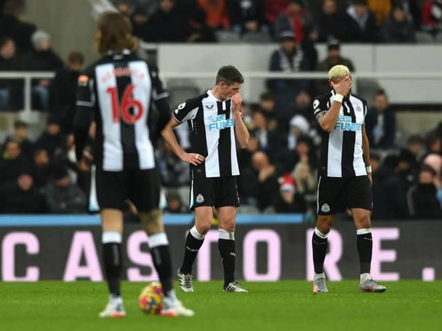 Ciaran Clark (c) and Joelinton of Newcastle react after the fourth City goal during the Premier League match between Newcastle United  and  Manchester City at St. James Park on December 19, 2021 in Newcastle upon Tyne, England. (Photo by Stu Forster/Getty Images)