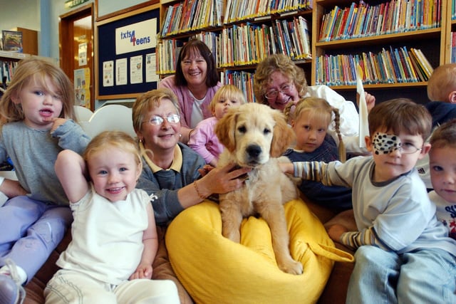 Youngsters got to meet Inca the guide dog, as well as Jennifer Emmerson from Guide Dogs for the Blind Association, during a story time session in 2004.