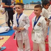 Joseph Woodward, Josh Parkin and Myah Hackett with their medals.