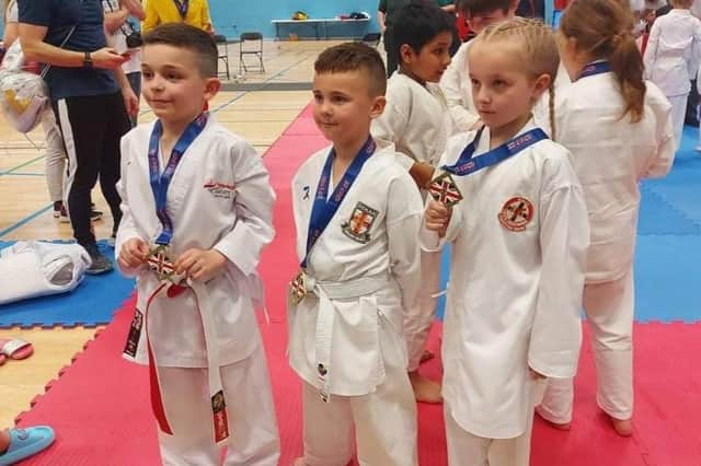 Joseph Woodward, Josh Parkin and Myah Hackett with their medals.