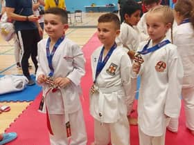 Joseph Woodward, Josh Parkin and Myah Hackett with their medals.