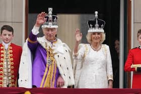 King Charles III and Queen Camilla on the balcony of Buckingham Palace following the coronation on May 6.  