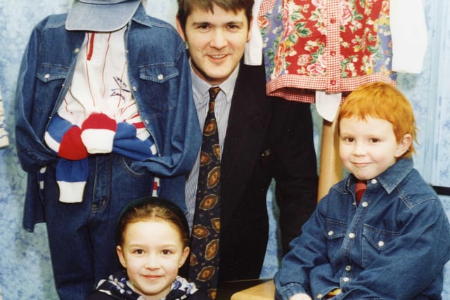Brother and sister Harry and Rebecca Klein were the winners of a Binns colouring competition. Here they are receiving their prizes from Binns manager, Neil Setterfield in March 1994.