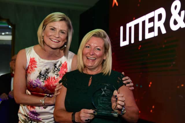 Litter & Laugh Walk founder Angela Todd (right) receives the 2019 Greener South Tyneside Award from Liz Davis, head of communications at the South Tyneside & Sunderland NHS Foundation Trust.