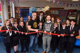 Author Dan Smith alongside Hebburn Comprehensive School's pupils and librarian, Liam Owens, at the official opening of the school's new library.