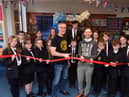 Author Dan Smith alongside Hebburn Comprehensive School's pupils and librarian, Liam Owens, at the official opening of the school's new library.