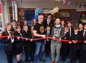 Author Dan Smith alongside Hebburn Comprehensive School's pupils and librarian, Liam Owens, at the official opening of the school's new library.