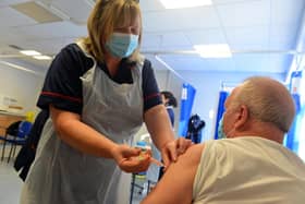 Clinical lead nurse Louise Frelford gives a Covid vaccination to a patient at Grindon Lane Primary Care Centre in Sunderland.