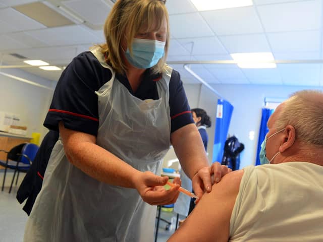 Clinical lead nurse Louise Frelford gives a Covid vaccination to a patient at Grindon Lane Primary Care Centre in Sunderland.
