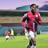 JJ Hooper, celebrating a goal against Gainsborough Trinity, with the new CEFO Ground Stand behind him. Picture: KEV WILSON.