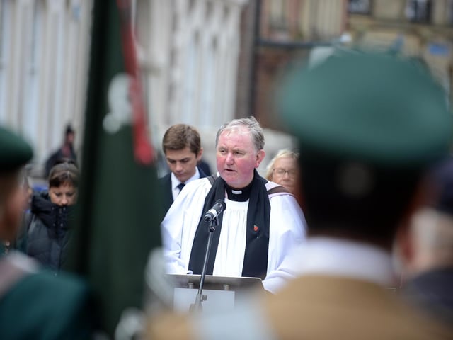 Father Mark MahWhinney leads Anzac Day service at the John Simpson Kirkpatrick memorial statue.