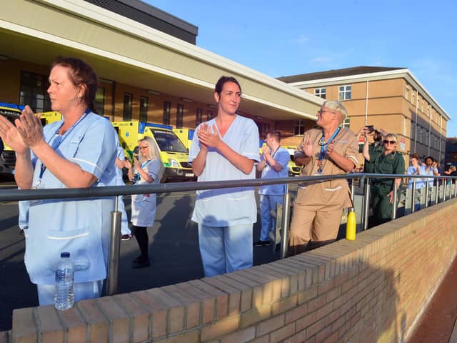 Hospital staff clapping for all carers.