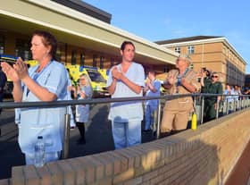 Hospital staff clapping for all carers.