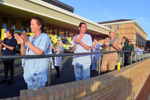 Hospital staff clapping for all carers.
