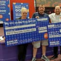 Jeff Short collecting his winnings at Buzz Bingo