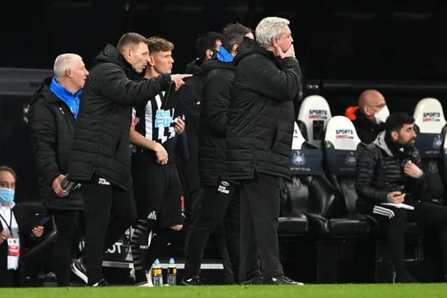 NEWCASTLE UPON TYNE, ENGLAND - FEBRUARY 27: Newcastle substitute Matt Ritchie is given instructions before coming on from coach Graeme Jones as manager Steve Bruce (r) looks on during the Premier League match between Newcastle United and Wolverhampton Wanderers at St. James Park on February 27, 2021 in Newcastle upon Tyne, England.