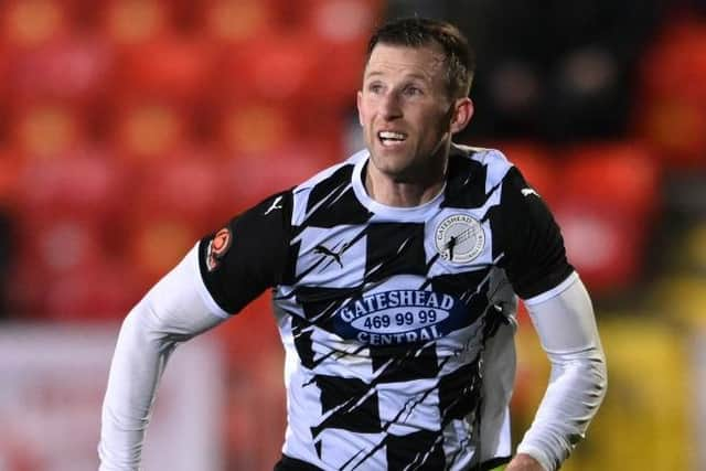 Gateshead player-manager Mike Williamson in action last season.