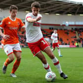 Dan Barlaser, right, playing for Rotherham United.