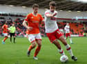 Dan Barlaser, right, playing for Rotherham United.
