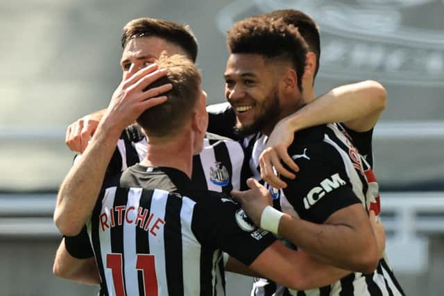 Joelinton celebrates his goal.