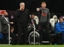 NEWCASTLE UPON TYNE, ENGLAND - OCTOBER 17: Newcastle manager Steve Bruce (l) with coach Graeme Jones on the touchline during the Premier League match between Newcastle United and Tottenham Hotspur at St. James Park on October 17, 2021 in Newcastle upon Tyne, England. (Photo by Stu Forster/Getty Images)