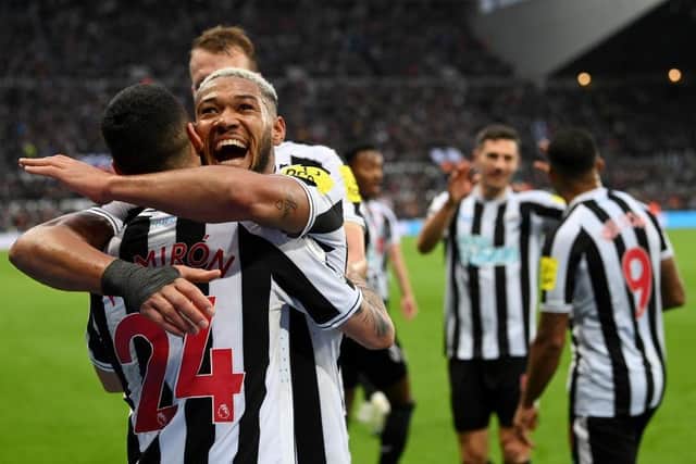 Miguel Almiron celebrates his goal, Newcastle's fourth, with Joelinton.