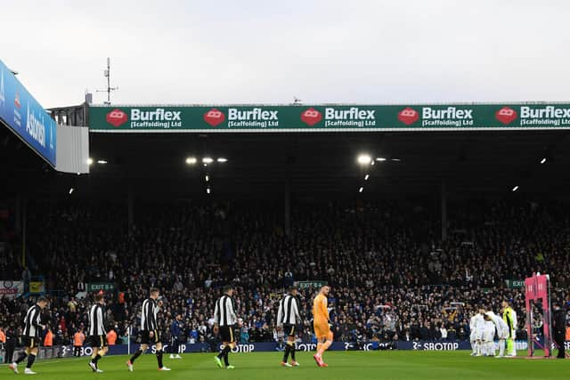 Newcastle United's Slovakian goalkeeper Martin Dubravka leads the Newcastle players out for the English Premier League football match between Leeds United and Newcastle United at Elland Road in Leeds, northern England on January 22, 2022. (Photo by Paul ELLIS / AFP) / RESTRICTED TO EDITORIAL USE. No use with unauthorized audio, video, data, fixture lists, club/league logos or 'live' services. Online in-match use limited to 120 images. An additional 40 images may be used in extra time. No video emulation. Social media in-match use limited to 120 images. An additional 40 images may be used in extra time. No use in betting publications, games or single club/league/player publications. /  (Photo by PAUL ELLIS/AFP via Getty Images)