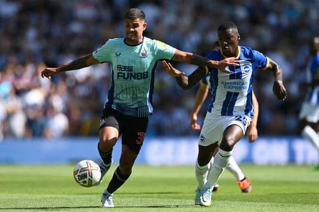 Newcastle United's Brazilian midfielder Bruno Guimaraes (L) vies with Brighton's Ecuadorian midfielder Moises Caicedo (R) during the English Premier League football match between Brighton and Hove Albion and Newcastle United at the American Express Community Stadium in Brighton, southern England on August 13, 2022. (Photo by GLYN KIRK/AFP via Getty Images)