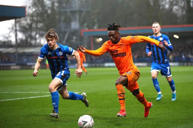 ROCHDALE, ENGLAND - JANUARY 04: Christian Atsu of Newcastle United runs past Luke Matheson of Rochdale during the FA Cup Third Round match between Rochdale AFC and Newcastle United at Spotland Stadium on January 04, 2020 in Rochdale, England. (Photo by Clive Brunskill/Getty Images)