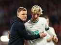 Newcastle United head coach Eddie Howe embraces Anthony Gordon.