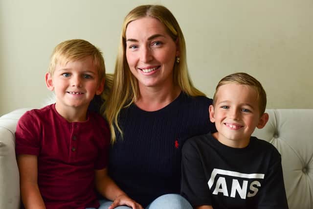 Grayson Stewart (right) with mum Regan and little brother Drew, who he looked after following Regan's fall