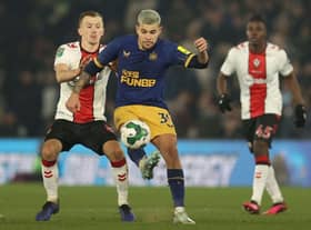 Newcastle United's Brazilian midfielder Bruno Guimaraes (C) vies for the ball during the English League Cup semi-final first-leg football match between Southampton and Newcastle United at St Mary's Stadium in Southampton, southern England on January 24, 2023. (Photo by ADRIAN DENNIS/AFP via Getty Images)