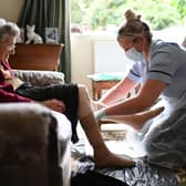 Families will be able to hug care home residents before Christmas as part of a new Government commitment. Photo: PA.