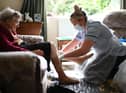 Families will be able to hug care home residents before Christmas as part of a new Government commitment. Photo: PA.