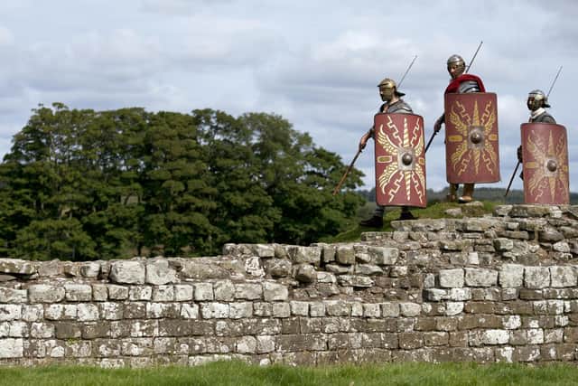 File picture of re-enactors portraying soldiers from the Imperial Roman Army (Photo credit should read OLI SCARFF/AFP via Getty Images)