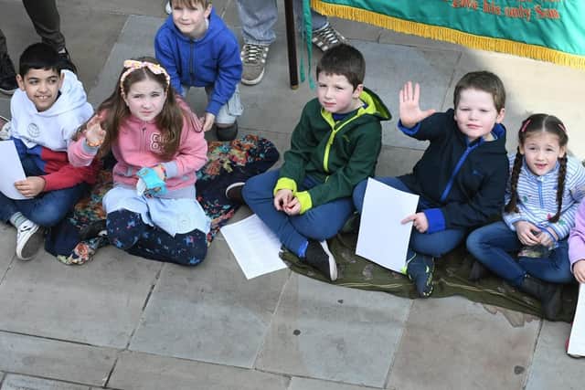 Children gather at the Market Place to take part in Good Friday service.