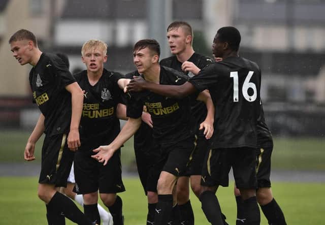 Oisin McEntee (C) of Newcastle United celebrates with team mates after opening the scoring with a header during the Super Cup NI u18 tournament group game between Newcastle United u18's and Komazawa University FC u18's at Scroggy Road on July 26, 2017 in Limavady, Northern Ireland. (Photo by Charles McQuillan/Getty Images)