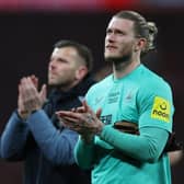 Newcastle United's German goalkeeper Loris Karius (R) applauds supporters on the pitch after the English League Cup final football match between Manchester United and Newcastle United at Wembley Stadium, north-west London on February 26, 2023. - Manchester United beat Newcastle 2-0 to win League Cup (Photo by ADRIAN DENNIS / AFP)