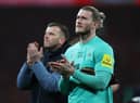 Newcastle United's German goalkeeper Loris Karius (R) applauds supporters on the pitch after the English League Cup final football match between Manchester United and Newcastle United at Wembley Stadium, north-west London on February 26, 2023. - Manchester United beat Newcastle 2-0 to win League Cup (Photo by ADRIAN DENNIS / AFP)