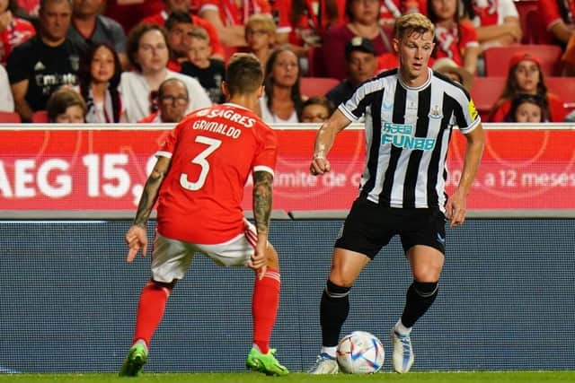 Emil Krafth of Newcastle United FC with Alex Grimaldo of SL Benfica in action during the Eusebio Cup match between SL Benfica and Newcastle United at Estadio da Luz on July 26, 2022 in Lisbon, Portugal.  (Photo by Gualter Fatia/Getty Images)