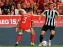Emil Krafth of Newcastle United FC with Alex Grimaldo of SL Benfica in action during the Eusebio Cup match between SL Benfica and Newcastle United at Estadio da Luz on July 26, 2022 in Lisbon, Portugal.  (Photo by Gualter Fatia/Getty Images)