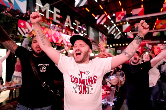 A file image from PA of England fans celebrating after the team secured their place in the final