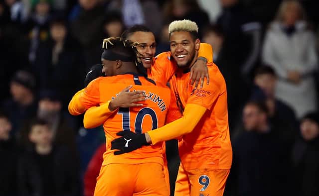 Newcastle United's Valentino Lazaro (centre) celebrates scoring his side's third goal of the game during the FA Cup fifth round match at The Hawthorns, West Bromwich. Tim Goode/PA Wire.