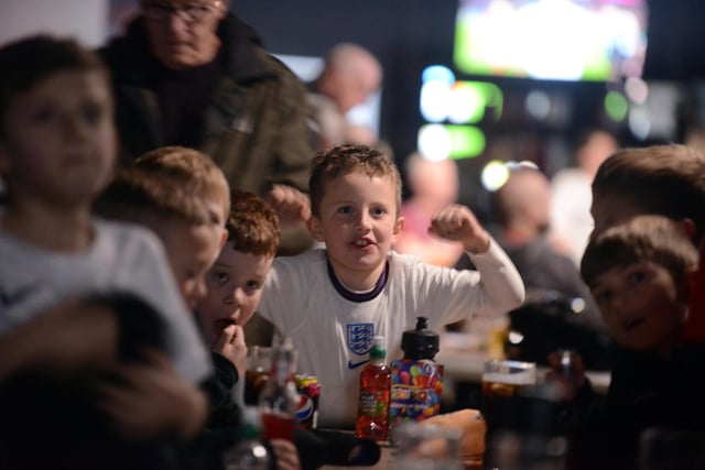 Young England fans captivated by the action.